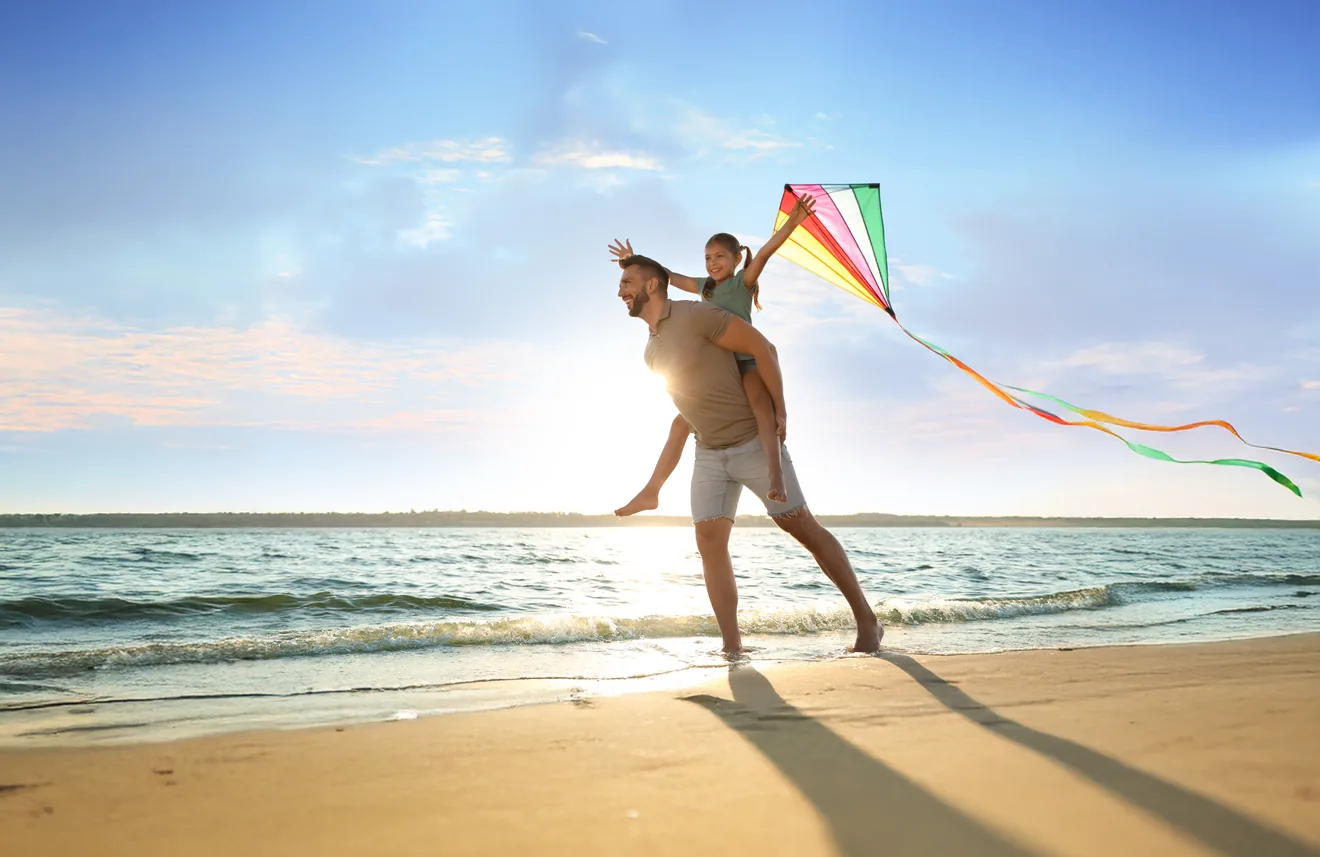 Stock Photo_father and daughter flying a kite